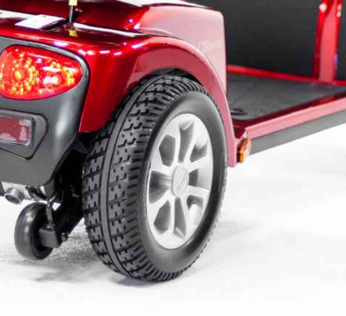 Silver rear wheel assembly MBW-0020 installed on a Golden Companion II 4-Wheel (GC440) mobility scooter, showing the silver rim and black 273x91 tire.