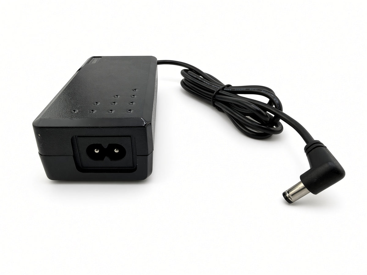 Hiboy DK1 charger showing the 2-pin AC power cord socket and right-angle coaxial DC barrel plug