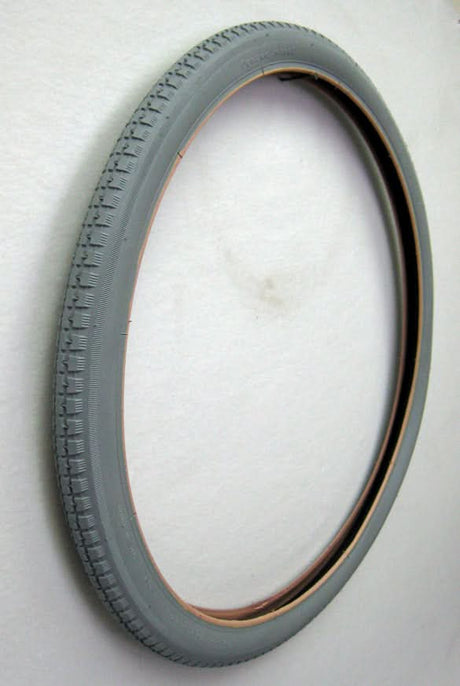24x1-3/4 Pneumatic Wheelchair Tire with black rim and street tread, designed for Everest & Jennings wheelchair models. Non-marking gray rubber, tube sold separately.