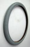 24x1.75 Pneumatic Wheelchair Tire on a white surface, featuring non-marking gray rubber with street tread. Tube sold separately.