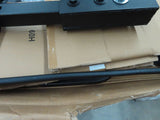 Folding Mighty Lite Aluminum Scooter and Power Chair Carrier (Blemished) on cardboard boxes, showcasing its black metal structure with a visible screw on top.