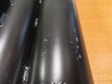 Crutch Holder for Pride Mobility Scooters (Blemished) featuring a black metal tube with white spots, designed to securely attach crutches to mobility scooters.