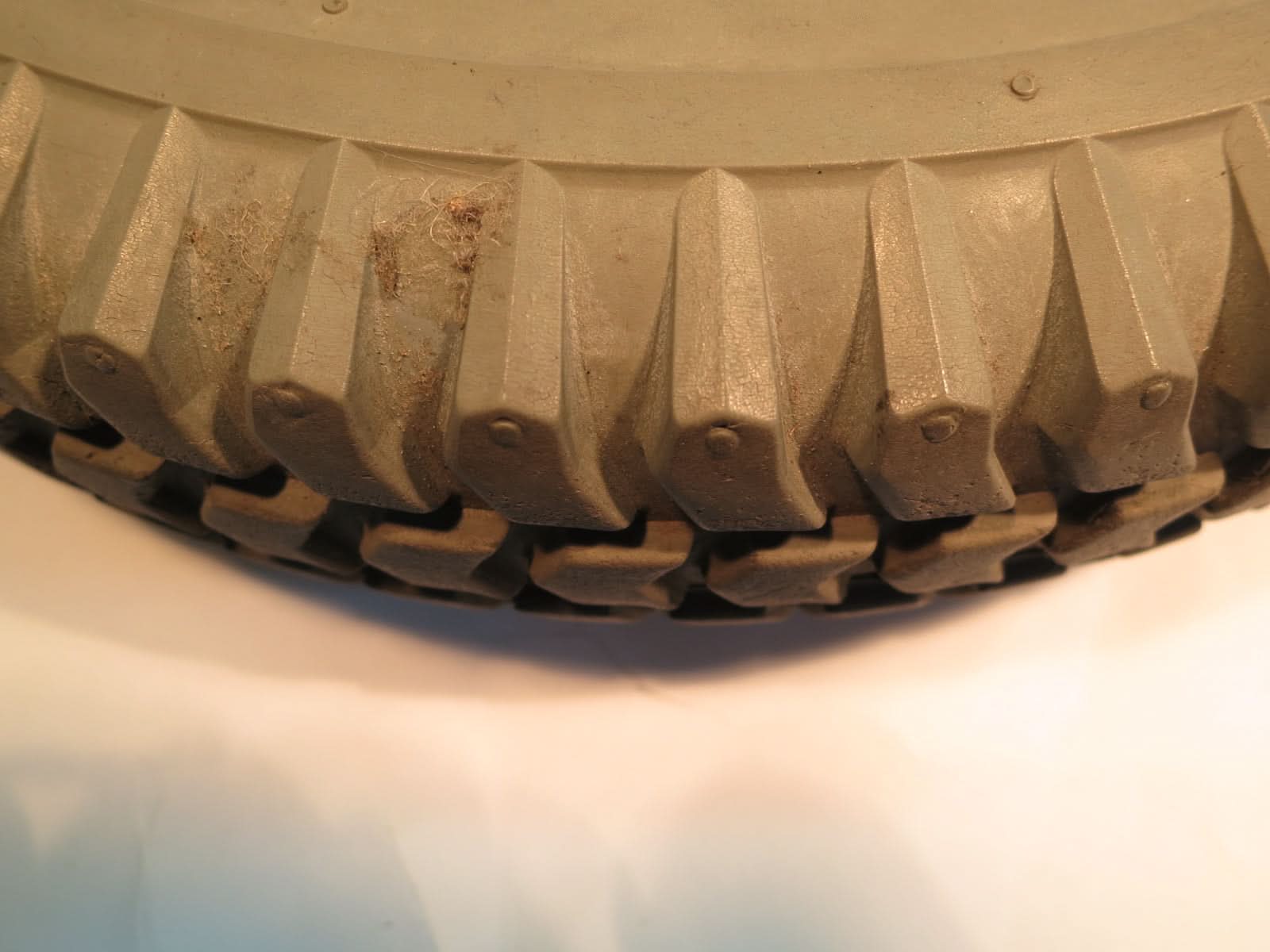 Close-up of the 14x3 (3.00-8) Flat-Free Drive Wheel Assembly for Jazzy 614, 614HD, & Quantum Q614, featuring a star rim and detailed tire treads.
