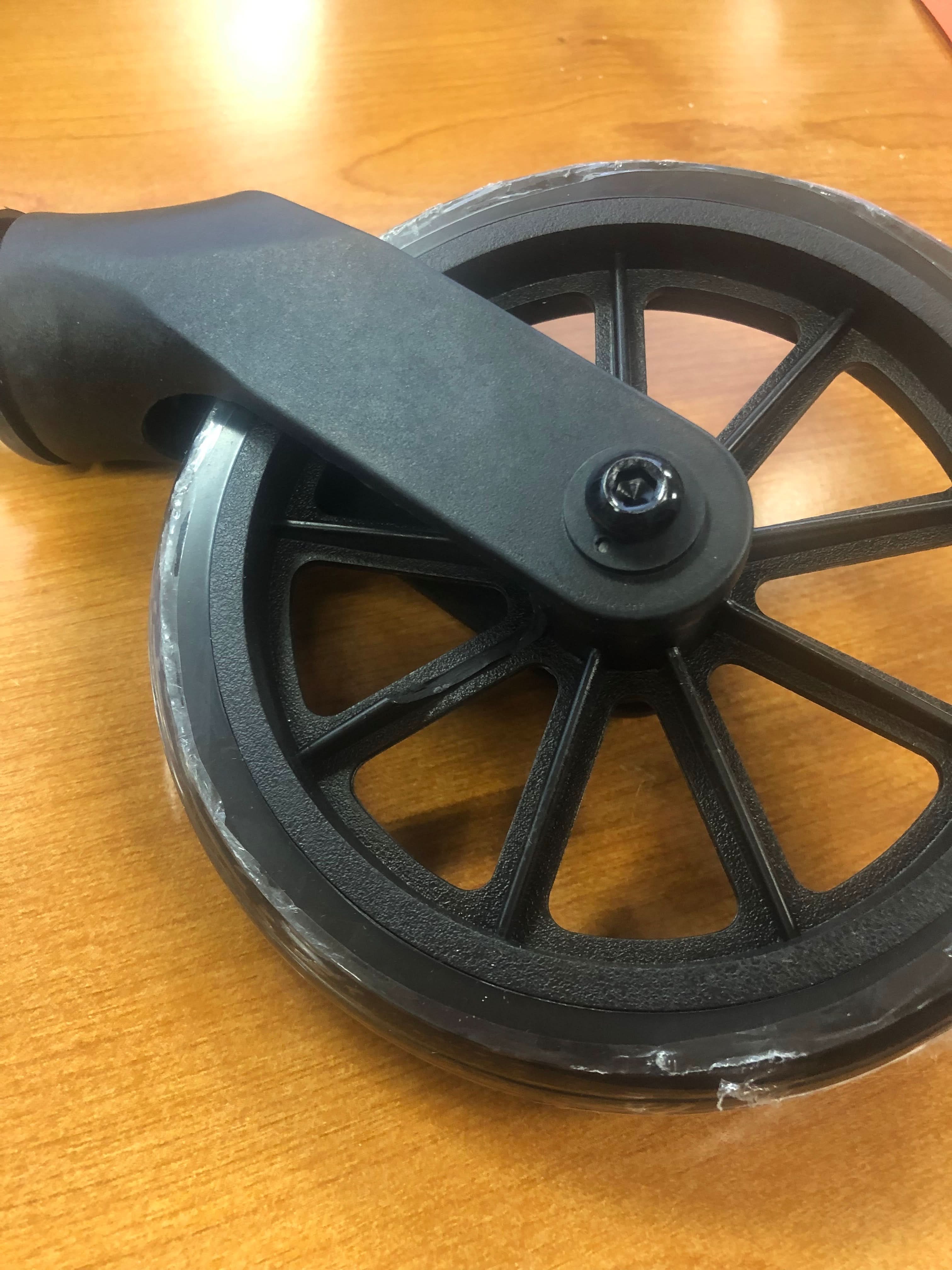 Front Caster Assembly for the Drive Medical Rollator with 6 Wheels (R800) and Drive Medical Aluminum Rollator with 6 Casters (R726), featuring a wheel with a black plastic handle and visible mounting screw.