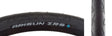 Close-up of a 26x1.5 ZRS Wire/60 Bicycle Tire showcasing its smooth center and grooved shoulders designed for enhanced corner traction.