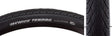 Close-up of a 26x1.5 Reflective Kwick Tendril Bicycle Tire, showcasing its minimal tread, continuous center ridge, and reflective sidewall striping designed for city riding and commuting.