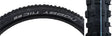 Close-up of the 29x2.25 Nobby Nic Evolution SnakeSkin Bicycle Tire, showcasing its robust outer blocks with V-grooves for enhanced braking and cornering, ideal for racing and trail riding.