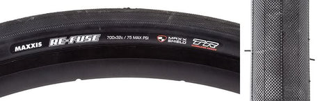 Close-up of the 700x32 Re-Fuse DC/MS/TR Bicycle Tire, highlighting the diamond knurled slick design and black metal cylinder, showcasing its durable build ideal for training and enhanced grip.