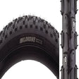 Close-up of the 700x40 Klondike Skinny Sport Bicycle Tire, showcasing its updated tread design with alternating tungsten carbide-tipped studs, suitable for winter cyclocross or commuter bicycles.