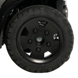 13x3.50-8 wheel assembly installed on a Pride Pursuit 2 mobility scooter, close-up of the black rim and tire