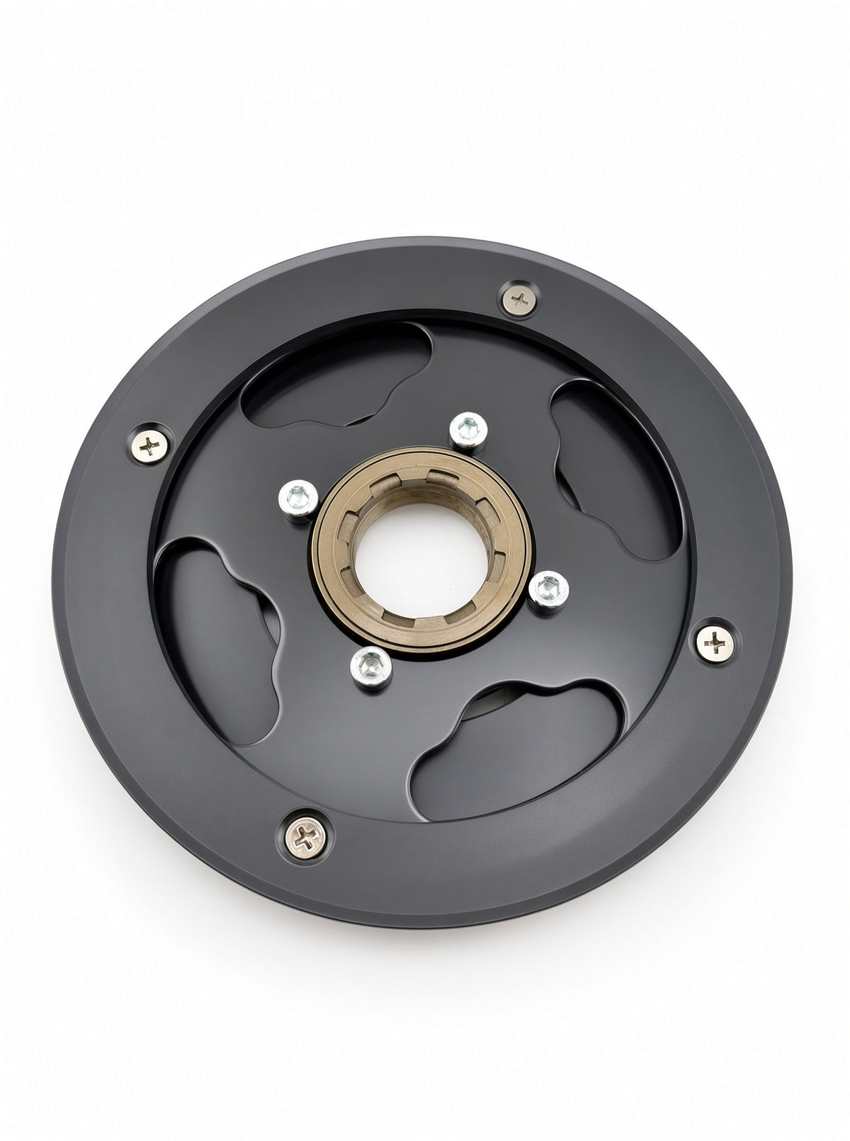 A circular black metal mechanical component with a central gold-toned ring, six silver screws, and cutout slots, photographed on a plain white background.