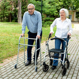 A man and woman using the Drive Medical Durable 4-Wheel Rollator (10257) with hand brakes and comfortable loop handles.