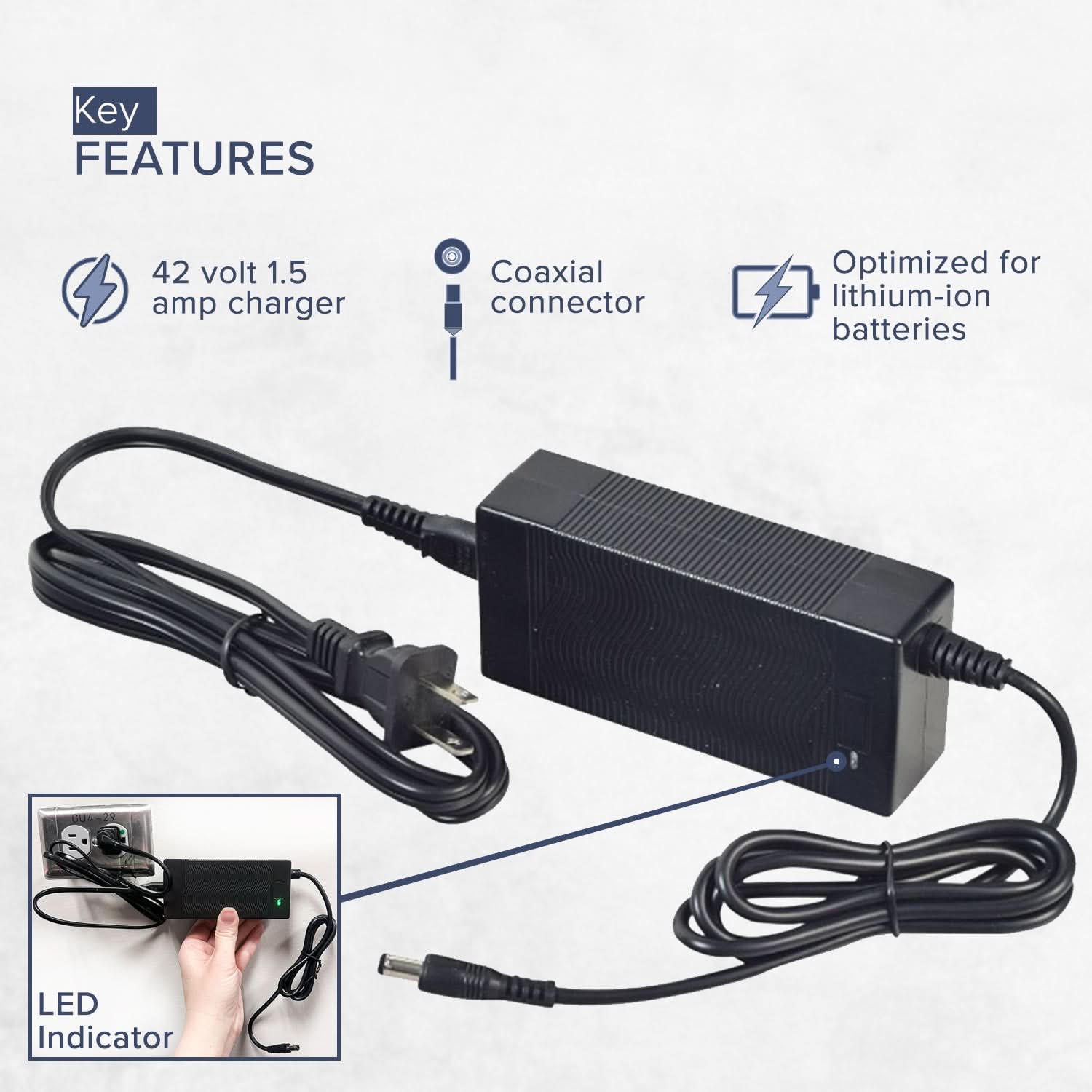 42 Volt Charger for Jetson® Bolt & Bolt Pro Electric Bicycles, featuring a black power cord with a blue indicator light and a coaxial connector, held by a hand for a clear view.