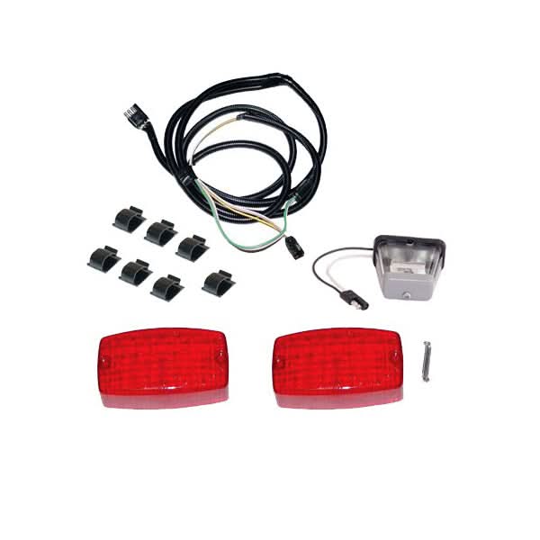 Close-up of the Tail Light Kit with License Plate Light, featuring red reflectors and black plastic clips, designed for VersaHaul carriers, providing additional illumination for scooters, ATVs, and sport bikes.