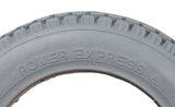 Close-up of the 12-1/2x2-1/4 Foam-Filled Mobility Tire with C628 Knobby Tread, showcasing its detailed tread pattern and solid, non-marking gray rubber design, ideal for mobility scooters and power chairs.