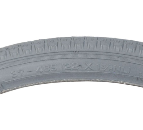 22x1-3/8 Pneumatic Wheelchair Tire with C63 Street Tread, featuring visible numbers and letters on its gray surface, designed for Everest & Jennings wheelchair models.