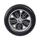 10” x 3” Flat-free Drive Wheel Assembly for Drive Titan & Titan AXS Power Chairs, featuring a tire with a silver rim, complete with bearings and tread for durable, worry-free performance.