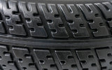 Close-up of the 3.00-4 (10x3) Black Flat Free Drive Wheel for the Golden Compass Sport (GP605SS/GP605CC) Power Chair, showcasing the solid black tire and silver rim.