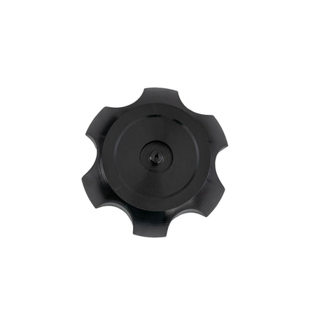 Fuel Tank Cap for the Coleman AT200-B ATV, a black circular gear with knobby protrusions around the 3-1/32 outer rim and a 2-1/16 inner diameter hole in the center.
