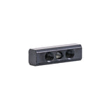 Lower Adjustment Flat Nut for Quantum Center Mount Footplates, a black rectangular object with two visible mounting holes, designed to adjust the height of center-mounted footplates.