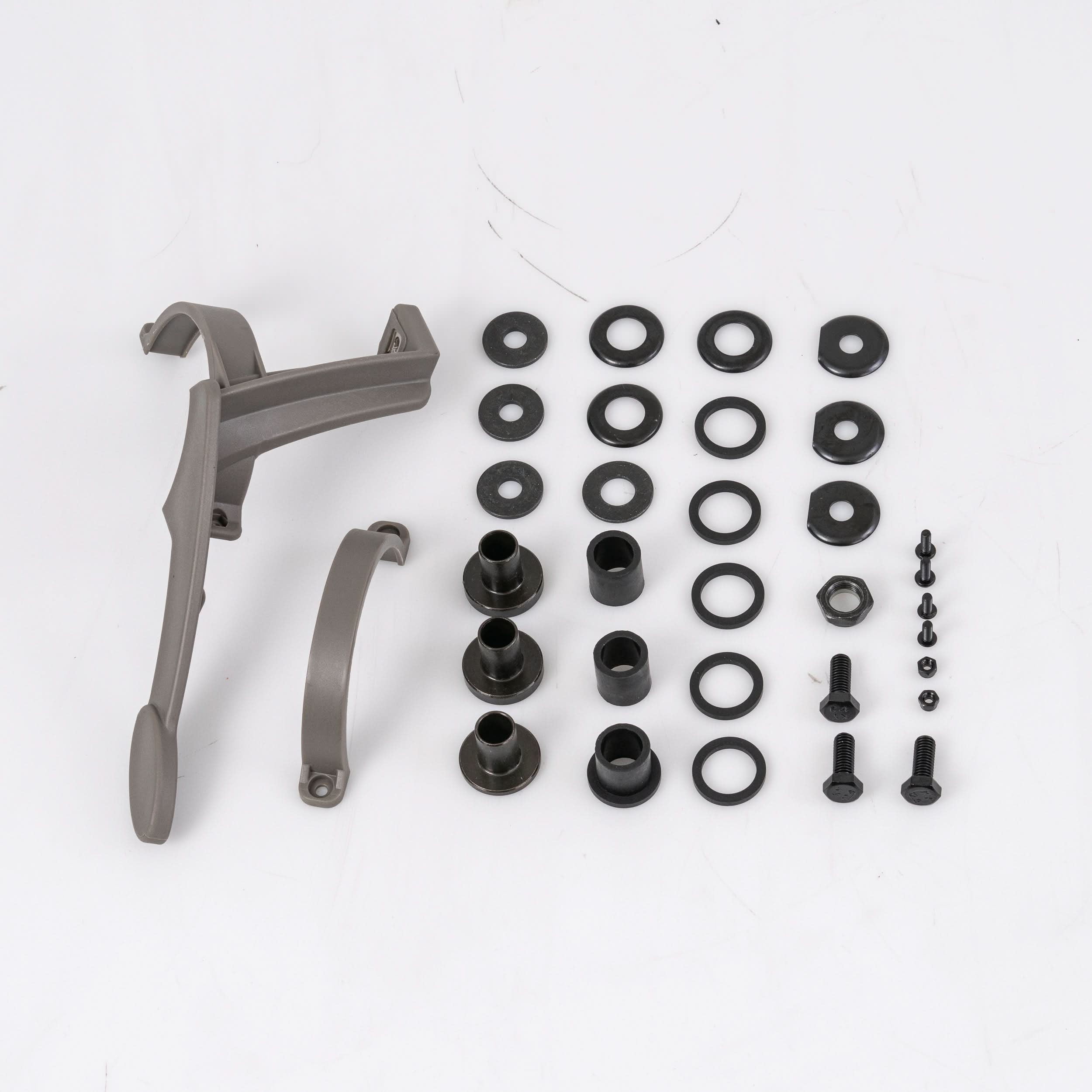 Left Motor and Gearbox Assembly with Freewheel and Mounting Hardware for the Jazzy Select, featuring various sizes of nuts, bolts, and black round metal components with holes, displayed on a white surface.