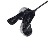 Close-up of the 7-speed right thumb gear shift lever for the HeyBike Explore fat tire electric bike, showcasing the Shimano brand label and gear mechanism.