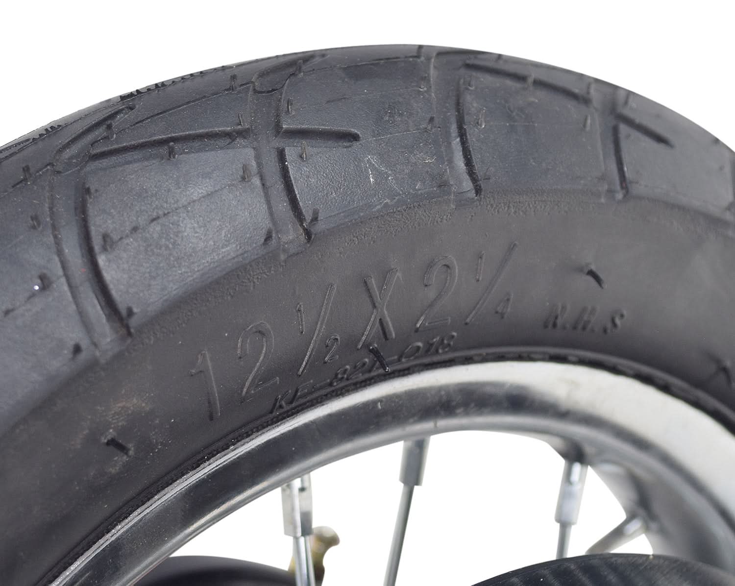 Close-up of the Rear Wheel Assembly with Wire Spoke Rim for the Razor Pocket Mod (Versions 13-30), showcasing the tire tread, wire spokes, and part of the rim.
