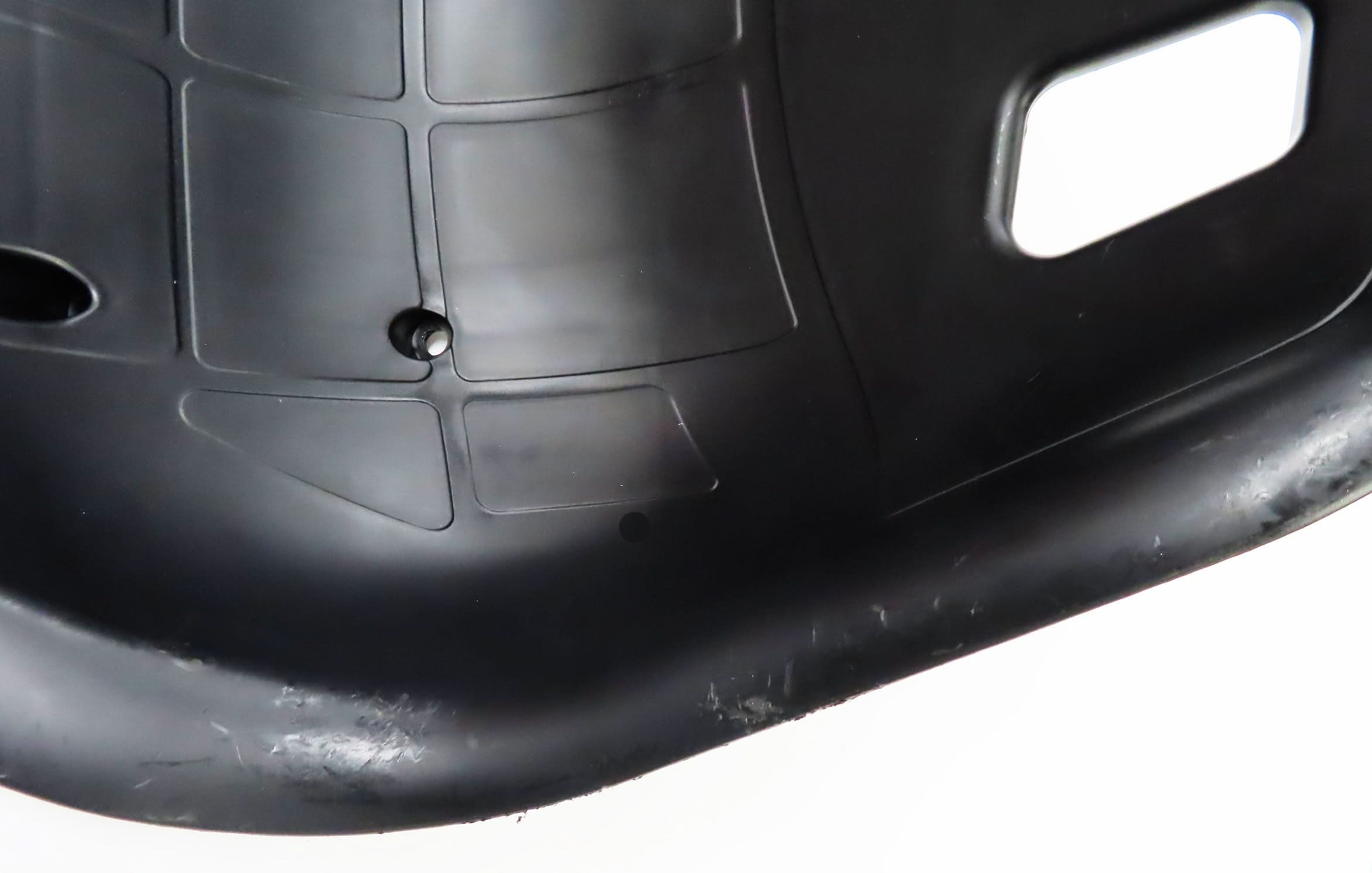 Deluxe Hoverboard Go-Kart Attachment Kit with Large Front Wheel & Suspension (Blemished) featuring black plastic surface, visible screws, and slight scratches on the black enamel finish and plastic seat.