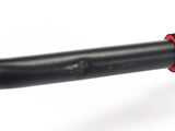 Close-up of the Deluxe Hoverboard Go-Kart Attachment Kit with Large Front Wheel & Suspension (Blemished), showcasing the black pipe and visible scratches on the black enamel finish and plastic seat.