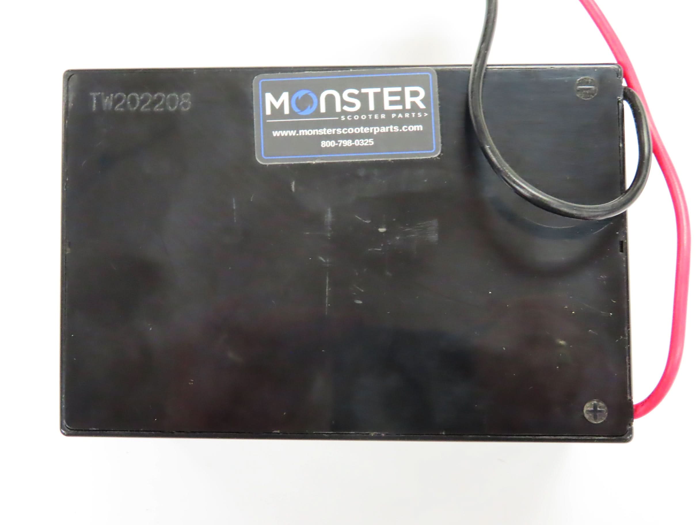 18 Volt Battery for the Minimoto Sport Racer (Blemished), featuring a black rectangular shape with a black wire and 2-prong connector, showing minor scrapes and scratches.