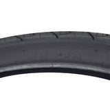Close-up of a 26x1.95 Black City Slick Bicycle Tire by Sunlite, showcasing the detailed tread pattern and robust synthetic rubber material.