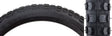 Close-up of a 20x2.125 Black MX Bicycle Tire with distinct treads, designed for replacement on bikes. This Sunlite tire is shown in detail, highlighting its sturdy construction.