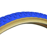20x1.75 Blue MX3/C714 Bicycle Tire, featuring a classic knobby BMX tread and skin sidewalls, shown in a close-up highlighting the detailed texture and tread pattern.
