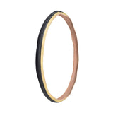 27x1-1/4 Black/Gum Urban Bicycle Tire showcasing a smooth center tread and knurled shoulders, designed for durability and efficient water evacuation. Features extra thick side walls and a cable bead for easy installation.
