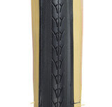 27x1-1/4 Black/Gum Urban Bicycle Tire featuring a close-up view of the durable thick rubber casing with smooth center tread and knurled shoulders designed for water evacuation and extra thick side walls.