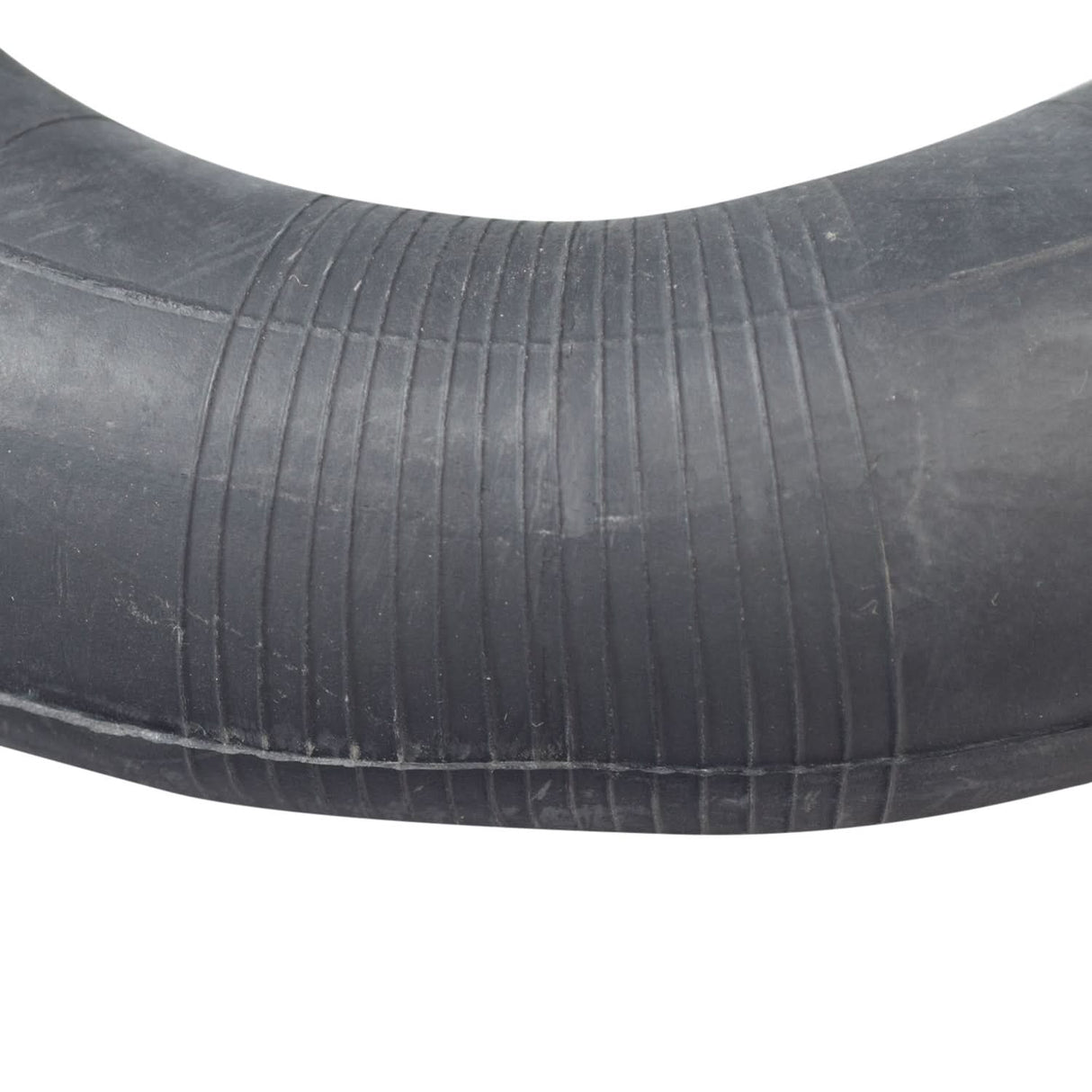 8-1/2x2 (50-134) Pneumatic Scooter Tire with P1034 Directional Tread, showcasing a black rubber tube with a curved edge and street-style pattern, ideal for small gas and electric scooters.
