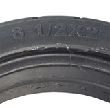 8-1/2x 2 Solid Tire for the Razor T25 Electric Scooter, showing a close-up of the black tire with visible tread pattern and numbers imprinted on the rubber surface.