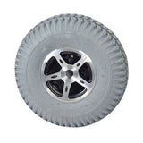 3.00-4 (260x85) Pneumatic Rear Wheel Assembly for the Merits Pioneer 4 (S141) Mobility Scooter featuring a silver rim and treaded tire, providing a smooth ride and reliable grip.