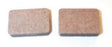 Metal Brake Pads for Arctic Cat Snowmobiles (1971-1981); close-up of two brown, rectangular-shaped brake pads with a textured surface.