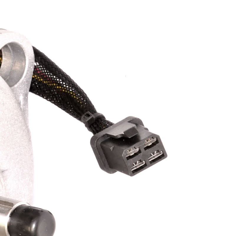 Close-up of the Right Drive Motor Assembly (CM808-075A/CM808-075B) for Jazzy Select & Select GT, showing a black cable, plug, and white component, highlighting its fully functional yet blemished condition.