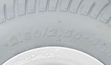 Close-up of the 9 flat-free caster wheel for the Quantum Rival power chair, showcasing the gray tire mounted on a silver rim with pre-installed bearings and spacer.