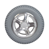 14x3 Flat Free 5-Spoke Wheel Assembly with Silver Rim for Quantum Q600, Q600XL, Q6000Z, and R4000 Power Chairs, featuring a robust tire with a sleek silver rim and five spokes.