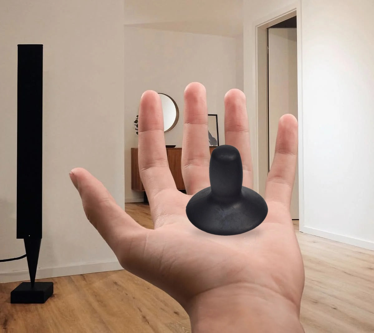 PG Drives replacement joystick knob resting in an open palm to show its actual size