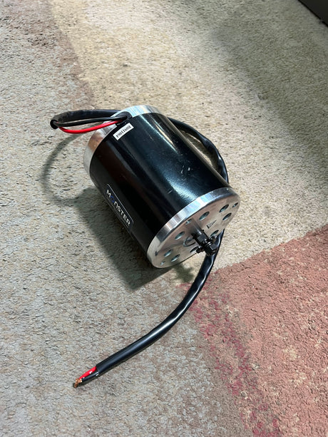 24 Volt 500 Watt MY1020 Electric Motor with 11 Tooth #25 Chain Sprocket (Blemished), featuring black wires and visible mounting holes for secure attachment.