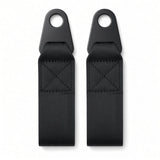 Two black steel eyelet mounting tabs with 5/8" hole and X-stitched webbing for bolting the seat belt to a power chair seat frame
