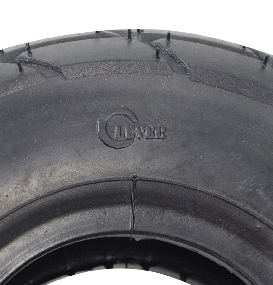 Close-up of a 10x3.50-4 (3.00-4) Minimoto Sport Racer Tire, showcasing its detailed rubber tread and sidewall markings.