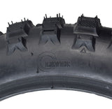 Close-up of the 2.5-10 Tire & Tube Set for Baja, Honda, Minimoto, Motovox, & Razor Dirt Bikes, showing the tire's textured surface and inner tube suitable for various dirt bike models.
