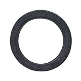 16x2.125 pneumatic tire for electric bicycles with directional, shallow-siped street treads, ideal for city streets. Close-up shows the tire's detailed tread pattern, enhancing grip and performance.