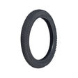 14x2.125 (57-254) Pneumatic Tire for Electric Bikes with knobby tread, ideal for both soft ground and hard concrete, shown in close-up displaying its robust rubber construction.