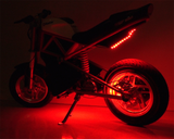 Multi-Color LED Light Kit for Razor Electric Bikes & Scooters, featuring a motorcycle with red LED lights illuminating its wheels and frame, showcasing customizable light functions for enhanced visibility and style.